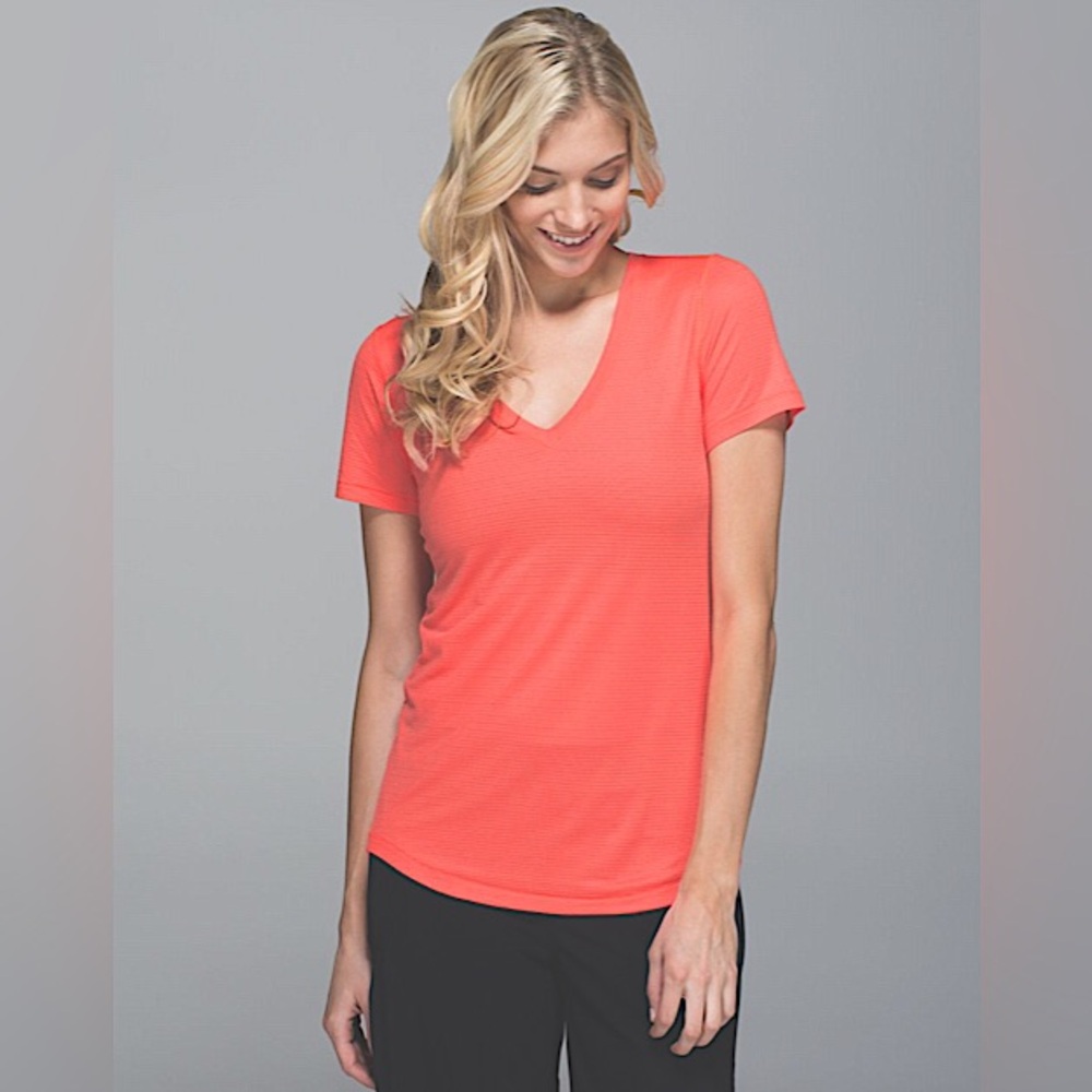 Lululemon What The Sport Tee *Mesh
in Grapefruit. 
Size 6. 
New without tags.